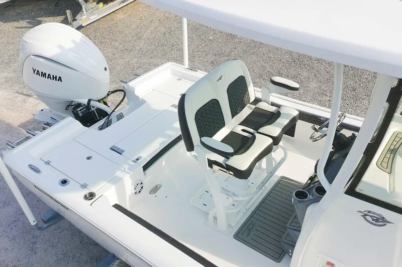 Slide: The Image of 2026 Tidewater 2300 Carolina Bay boat interior with Yamaha engine and dual seating. - 4