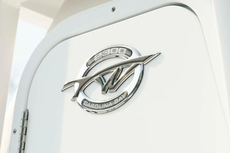 Slide: The Image of 2026 Tidewater 2300 Carolina Bay emblem on white surface. - 40