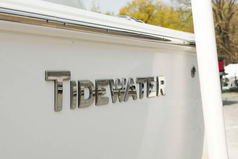 Slide: The Image of 2026 Tidewater 2300 Carolina Bay boat with chrome logo detail. - 41