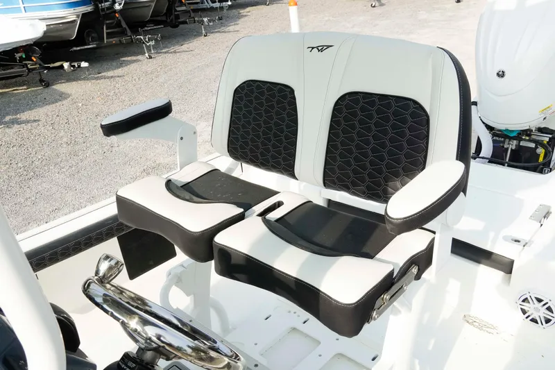 Slide: The Image of 2026 Tidewater 2300 Carolina Bay boat seating with black and white cushioned design. - 5