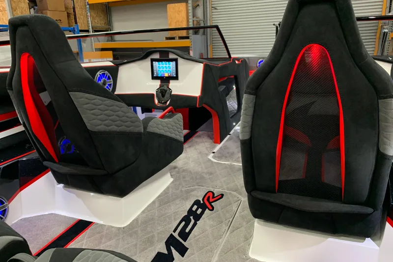 Slide: The Image of Interior of 2021 Daves Custom Boats M-28R with modern seats and dashboard. - 14