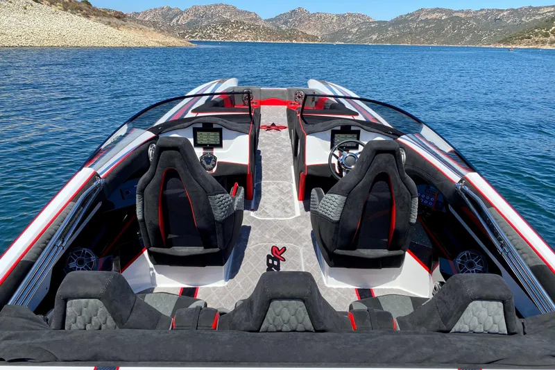 Slide: The Image of 2021 Daves Custom Boats M-28R interior with sleek design on a scenic lake. - 3