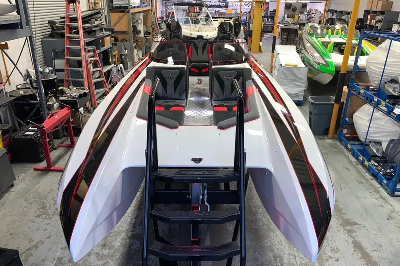Slide: The Image of 2021 Daves Custom Boats M-28R in workshop, showcasing sleek design and vibrant colors. - 6