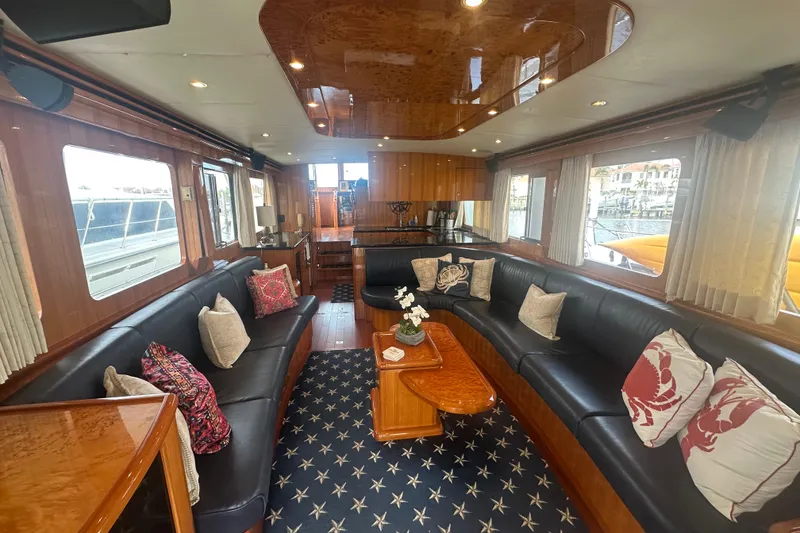 Slide: The Image of Luxurious interior of 2005 Jefferson Pilothouse 63 yacht with elegant seating and decor. - 13