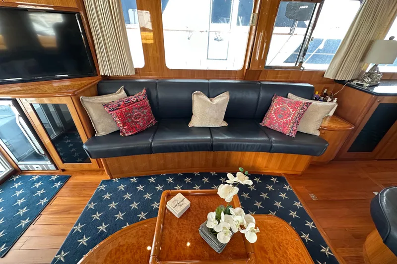 Slide: The Image of Luxurious interior of 2005 Jefferson Pilothouse 63 yacht with elegant seating and decor. - 16