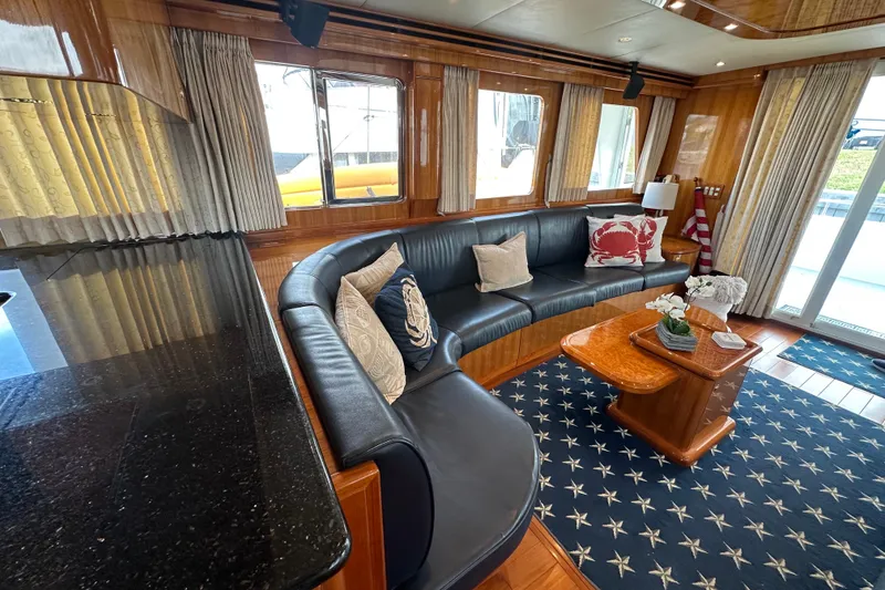 Slide: The Image of Luxurious interior of 2005 Jefferson Pilothouse 63 yacht with elegant seating and decor. - 17