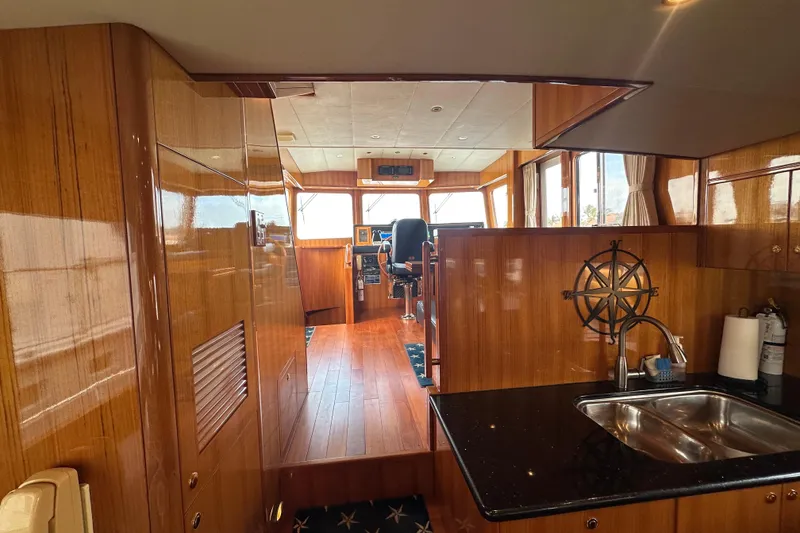 Slide: The Image of Luxurious interior of 2005 Jefferson Pilothouse 63 yacht with polished wood and modern amenities. - 20