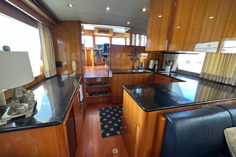 Slide: The Image of Luxurious interior of 2005 Jefferson Pilothouse 63 yacht with elegant wood and granite finishes. - 22