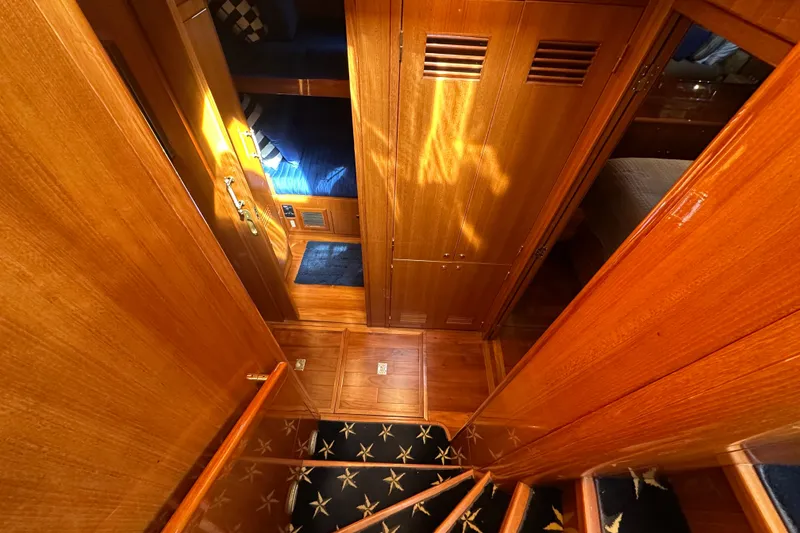 Slide: The Image of Interior of 2005 Jefferson Pilothouse 63 yacht with wooden finishes and star-patterned carpet. - 32