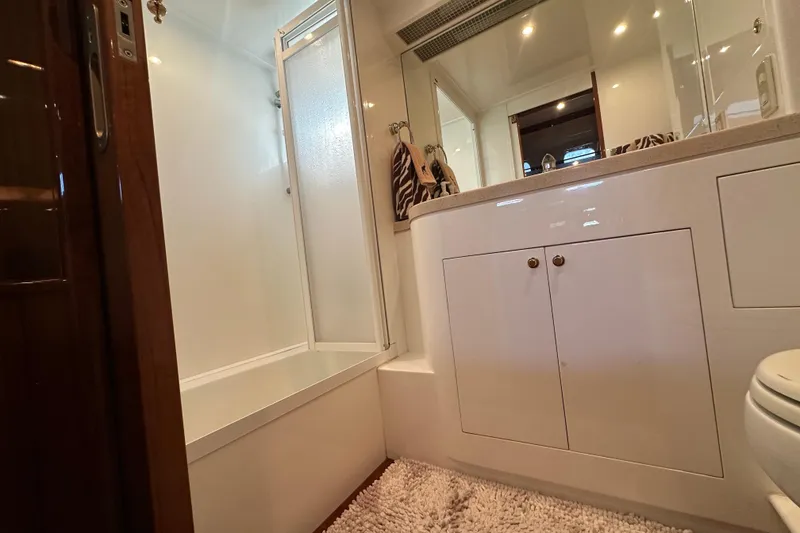 Slide: The Image of Luxurious bathroom interior of 2005 Jefferson Pilothouse 63 yacht with shower and vanity. - 36