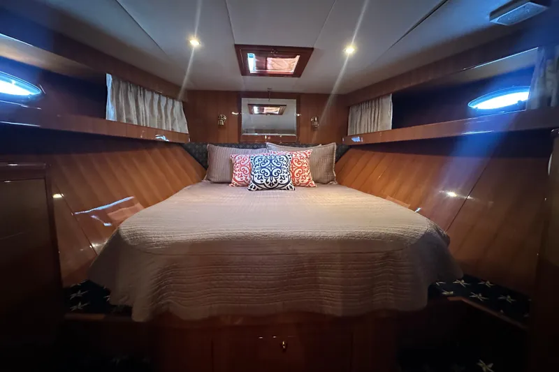 Slide: The Image of Luxurious cabin interior of 2005 Jefferson Pilothouse 63 yacht with elegant bedding. - 40