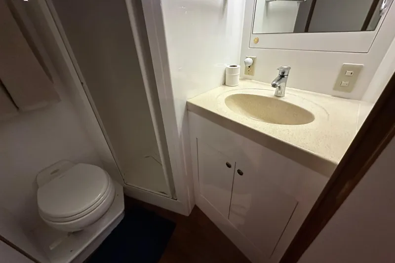 Slide: The Image of Bathroom interior of 2005 Jefferson Pilothouse 63 yacht, featuring sink and toilet. - 42