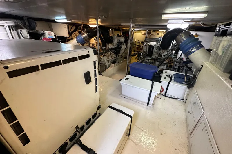 Slide: The Image of Engine room of a 2005 Jefferson Pilothouse 63 yacht, showcasing machinery and equipment. - 51