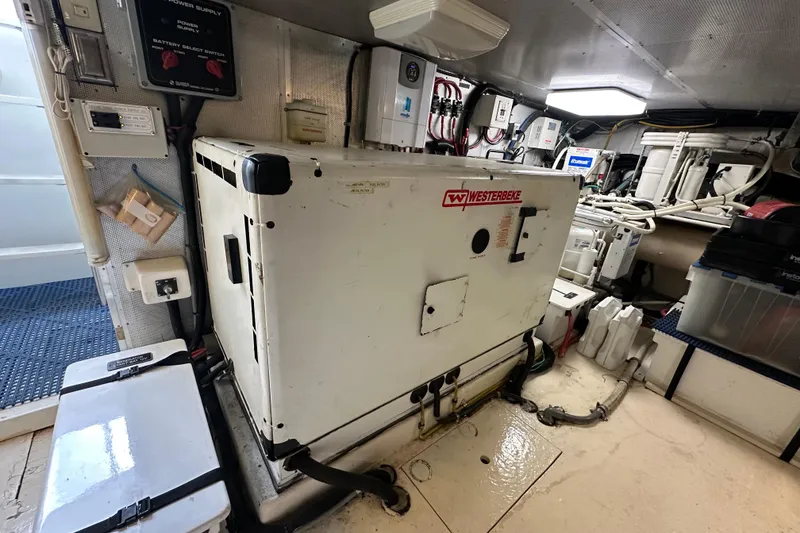 Slide: The Image of Engine room of 2005 Jefferson Pilothouse 63 yacht with Westerbeke generator. - 53