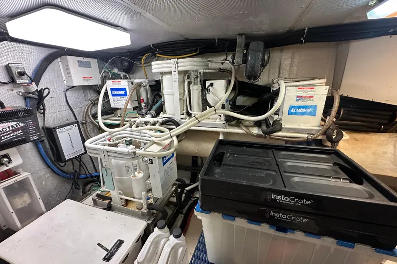 Slide: The Image of Engine room of a 2005 Jefferson Pilothouse 63 yacht with mechanical equipment. - 54