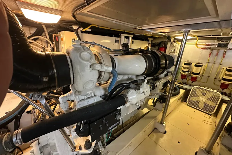 Slide: The Image of Engine room of a 2005 Jefferson Pilothouse 63 yacht, showcasing machinery and components. - 56