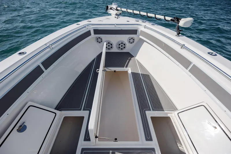 Slide: The Image of 2024 Contender 28 Tournament boat interior with storage compartments and speakers. - 16