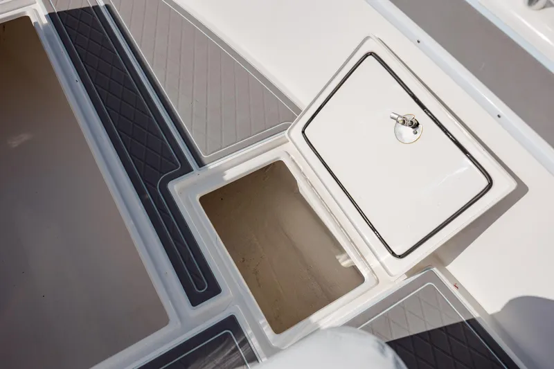 Slide: The Image of 2024 Contender 28 Tournament boat storage compartment with open hatch. - 18