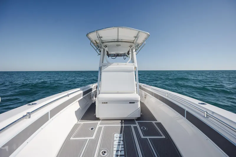 Slide: The Image of 2024 Contender 28 Tournament boat on open sea under clear blue sky. - 20