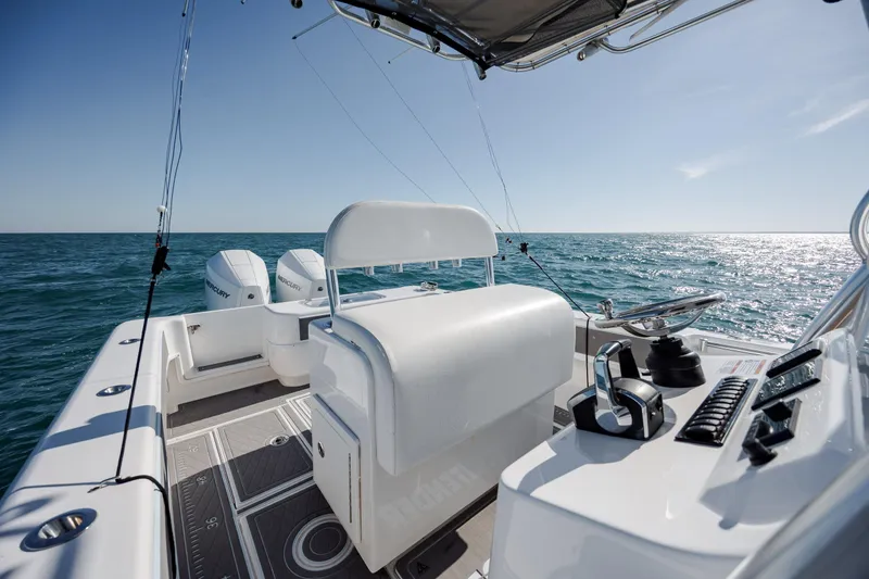Slide: The Image of 2024 Contender 28 Tournament boat interior with dual engines on open sea. - 21