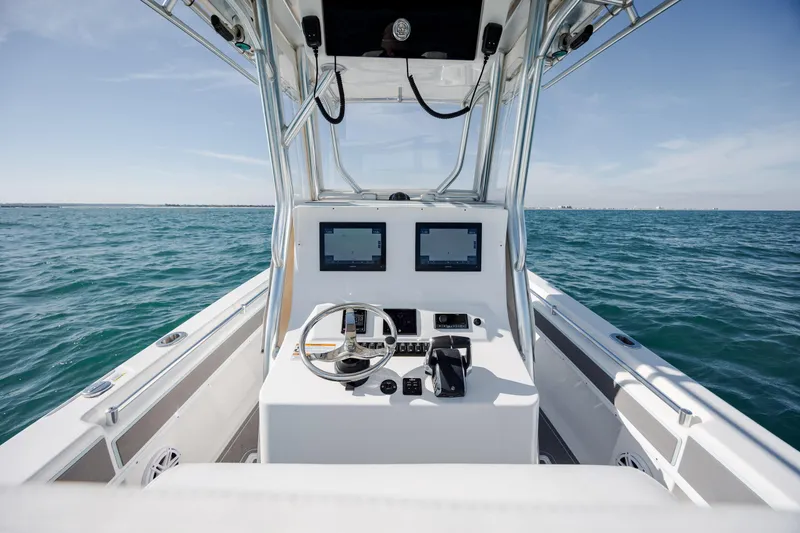 Slide: The Image of 2024 Contender 28 Tournament boat dashboard with dual screens on open water. - 22