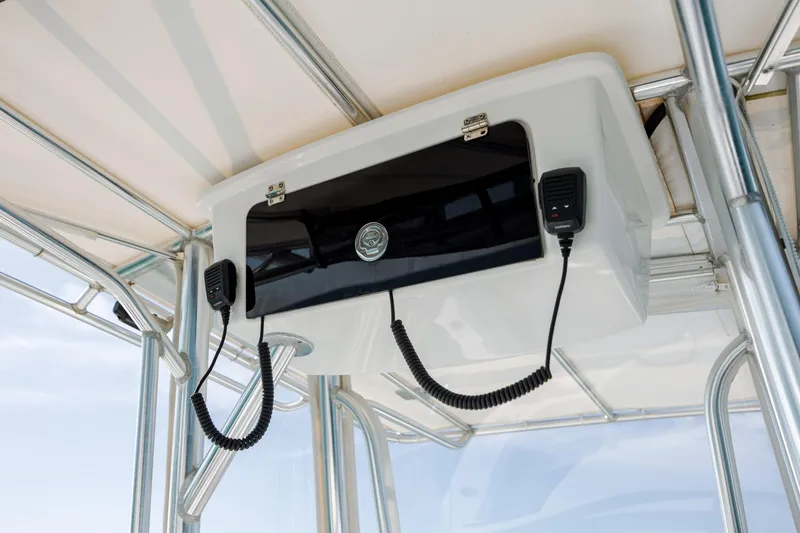 Slide: The Image of 2024 Contender 28 Tournament boat console with communication equipment and canopy. - 24
