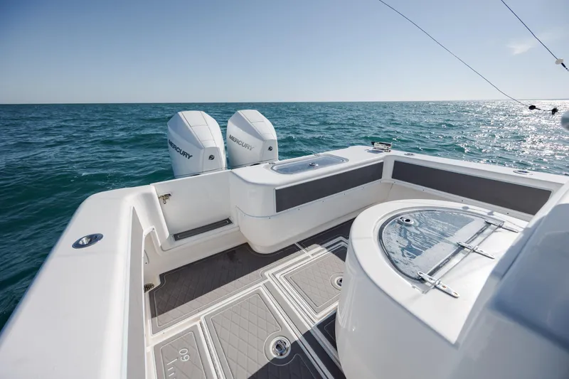 Slide: The Image of 2024 Contender 28 Tournament boat with dual Mercury engines on open sea. - 26