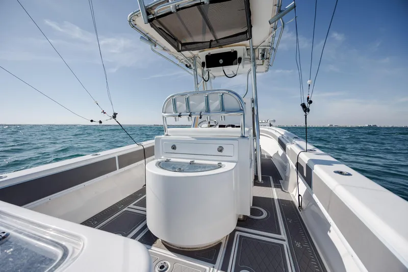 Slide: The Image of 2024 Contender 28 Tournament boat on open water, showcasing sleek design and fishing equipment. - 27