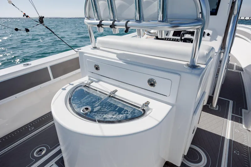 Slide: The Image of 2024 Contender 28 Tournament boat interior with fishing rod holders and storage. - 28