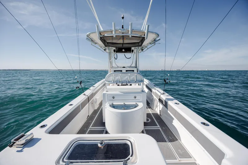 Slide: The Image of 2024 Contender 28 Tournament boat on open water, showcasing sleek design and fishing setup. - 29