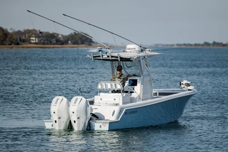Slide: The Image of 2024 Contender 28 Tournament boat with dual engines on open water. - 3