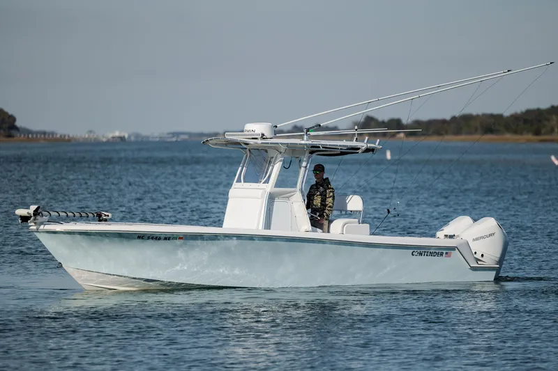 Slide: The Image of 2024 Contender 28 Tournament boat cruising on a calm waterway. - 7