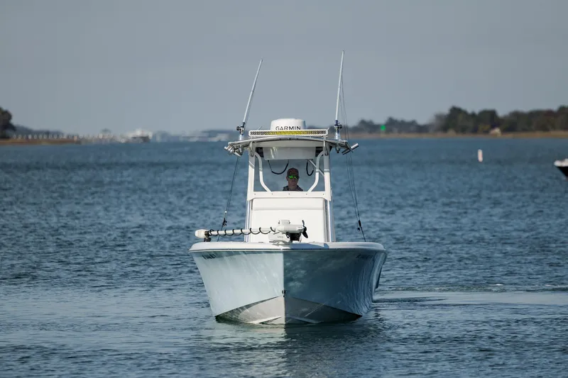 Slide: The Image of 2024 Contender 28 Tournament boat navigating calm waters. - 9