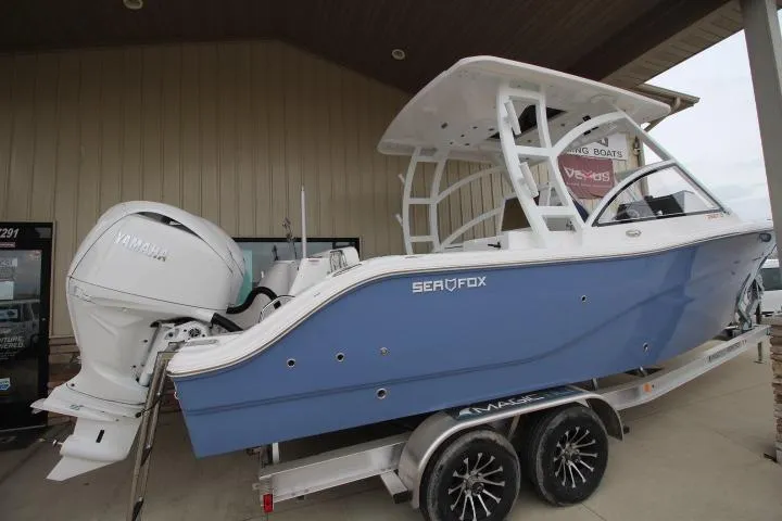 The Image of 2026 Sea Fox 268 Traveler boat on trailer with Yamaha engine, displayed outdoors. - 0