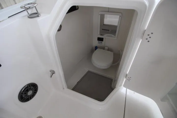 Slide: The Image of Interior view of 2026 Sea Fox 268 Traveler boat bathroom with toilet and mirror. - 10