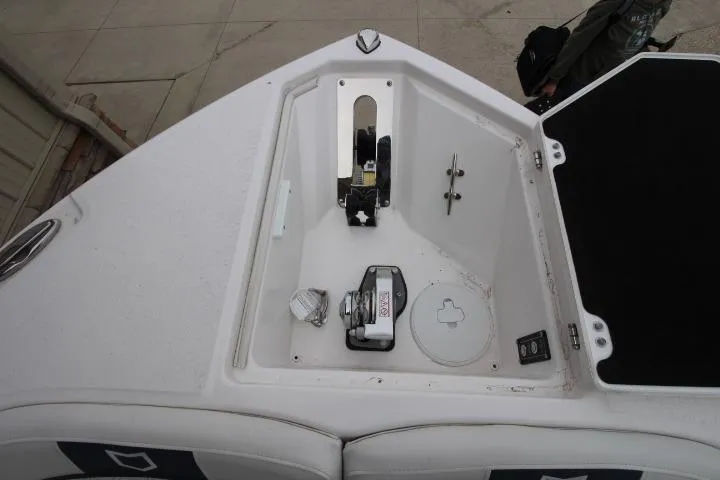 Slide: The Image of Bow anchor compartment of 2026 Sea Fox 268 Traveler boat, featuring winch and storage. - 13