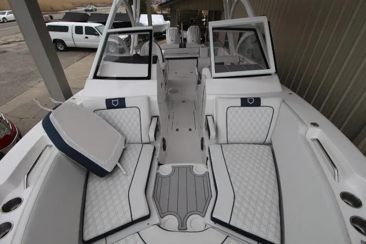 Slide: The Image of 2026 Sea Fox 268 Traveler boat interior with cushioned seating and open deck layout. - 14