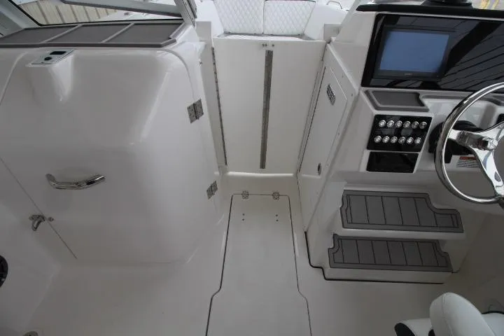 Slide: The Image of 2026 Sea Fox 268 Traveler boat interior with modern controls and sleek design. - 16