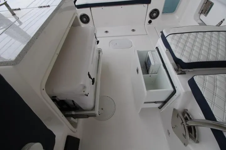 Slide: The Image of Interior view of 2026 Sea Fox 268 Traveler boat with seating and storage compartments. - 17