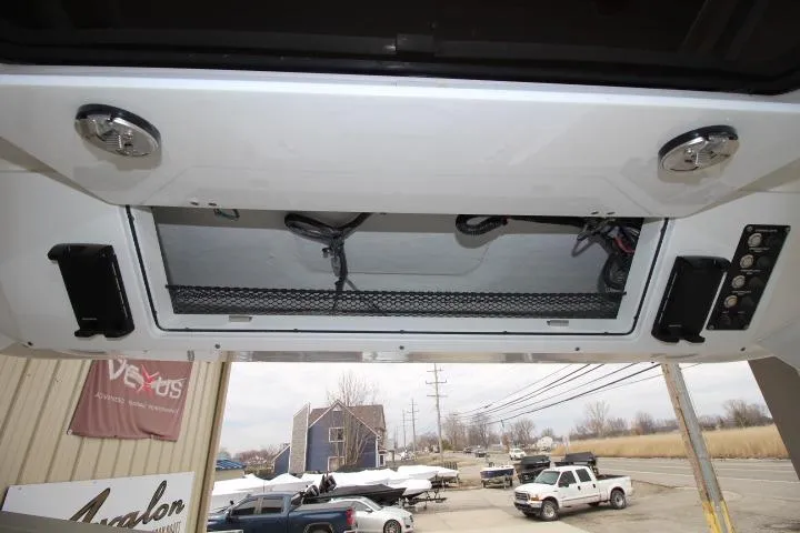 Slide: The Image of Interior view of a 2026 Sea Fox 268 Traveler boat, showcasing storage and control panel. - 19