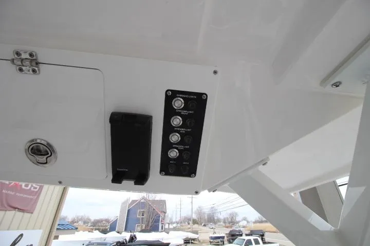 Slide: The Image of Control panel on 2026 Sea Fox 268 Traveler boat, featuring switches and storage compartment. - 20