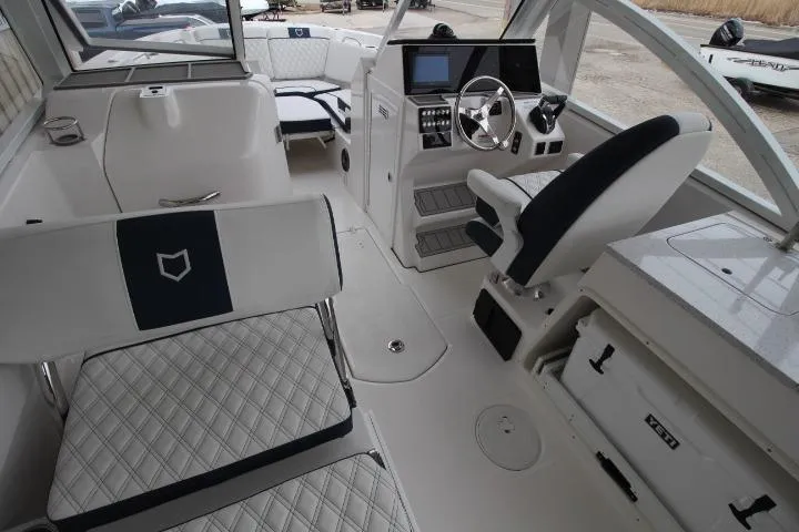 Slide: The Image of Interior of a 2026 Sea Fox 268 Traveler boat, featuring modern seating and control panel. - 23