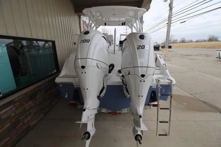 Slide: The Image of 2026 Sea Fox 268 Traveler boat with dual 200 horsepower engines, docked outdoors. - 24