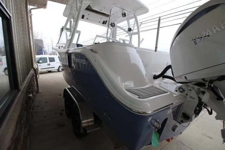 Slide: The Image of 2026 Sea Fox 268 Traveler boat with Yamaha engine, parked on a trailer. - 25