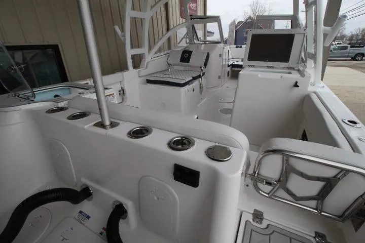 Slide: The Image of 2026 Sea Fox 268 Traveler boat interior with seating and control panel. - 4