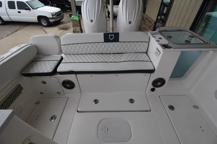 Slide: The Image of 2026 Sea Fox 268 Traveler boat interior with cushioned seating and storage compartments. - 5