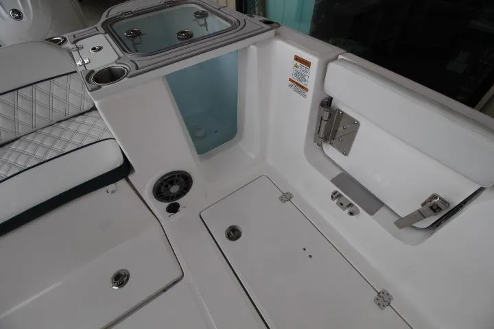 Slide: The Image of Interior view of 2026 Sea Fox 268 Traveler boat, featuring seating and storage compartments. - 6