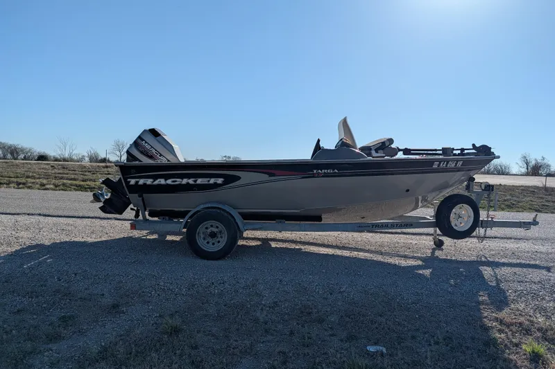 Slide: The Image of 2003 Tracker Targa 17 SC boat on trailer in outdoor setting. - 10