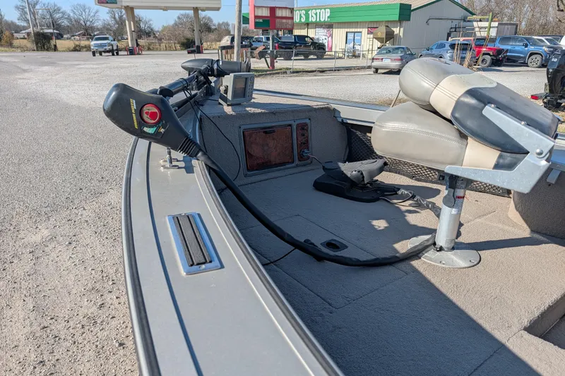 Slide: The Image of 2003 Tracker Targa 17 SC boat interior with seating and control panel. - 16