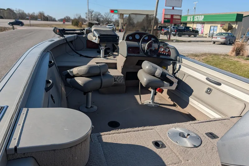 Slide: The Image of 2003 Tracker Targa 17 SC boat interior with seating and control panel. - 17